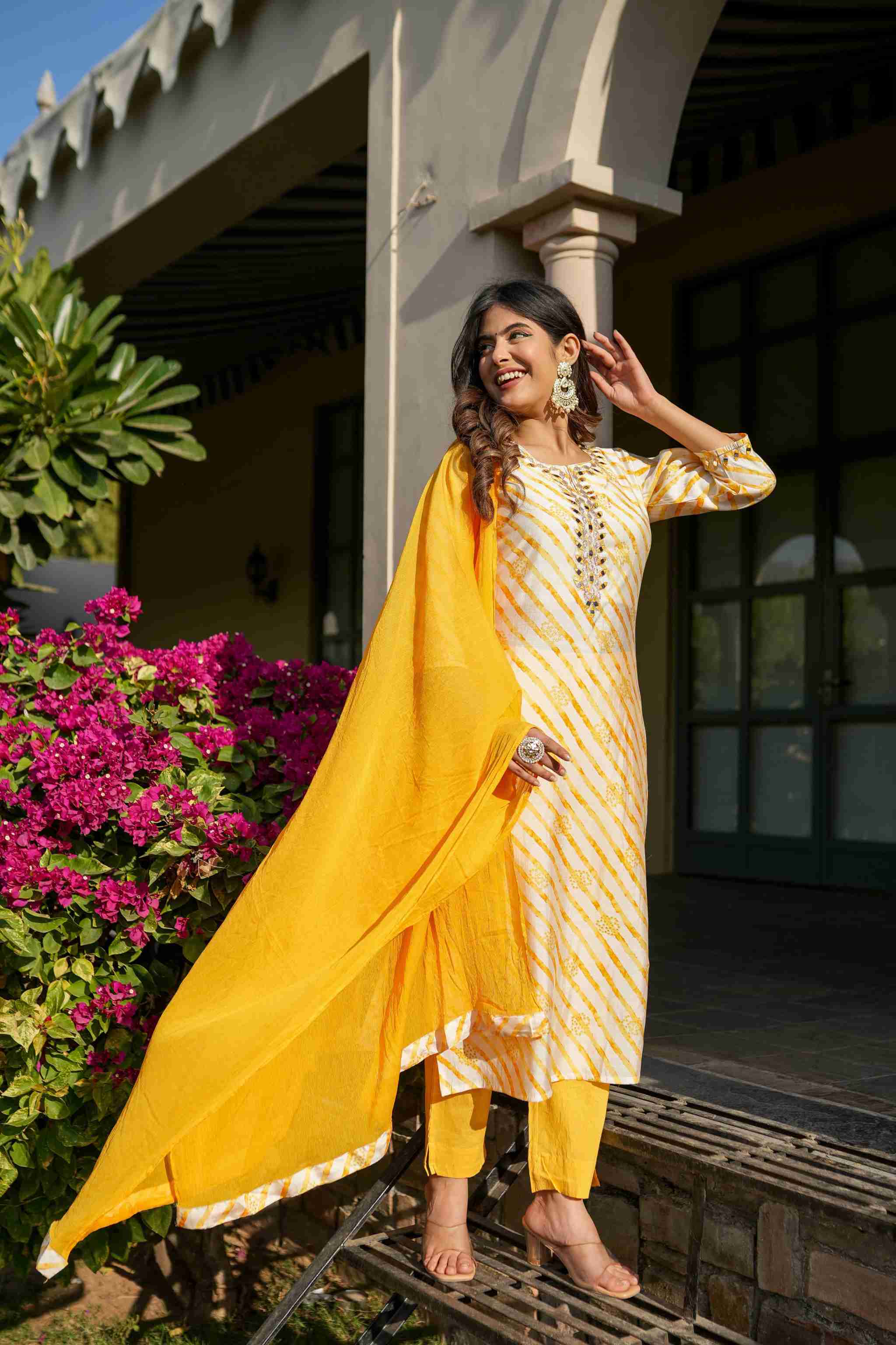 Yellow leheriya straight kurta set with mirror work