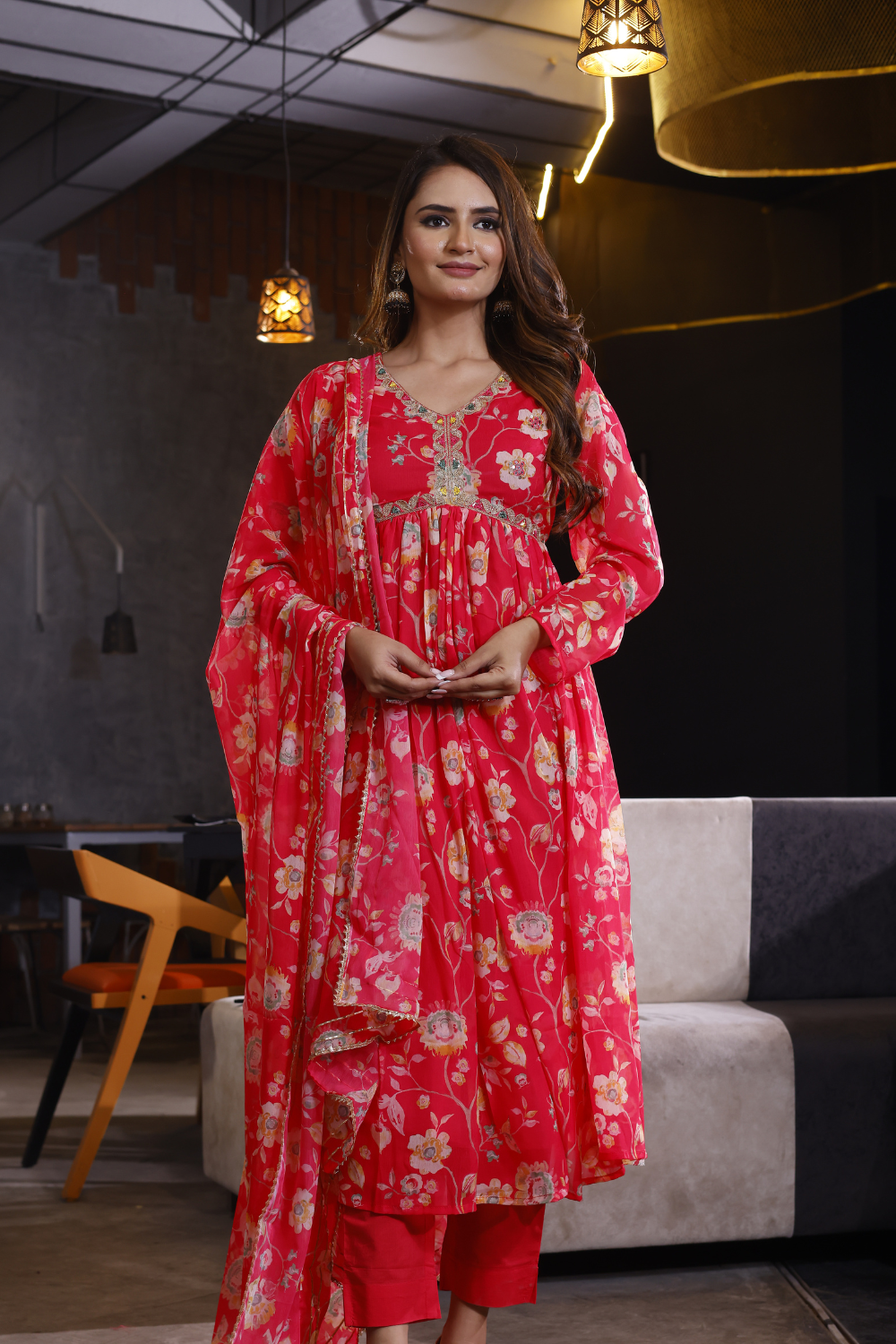 Red suit set featuring floral design in elegant chinon fabric.