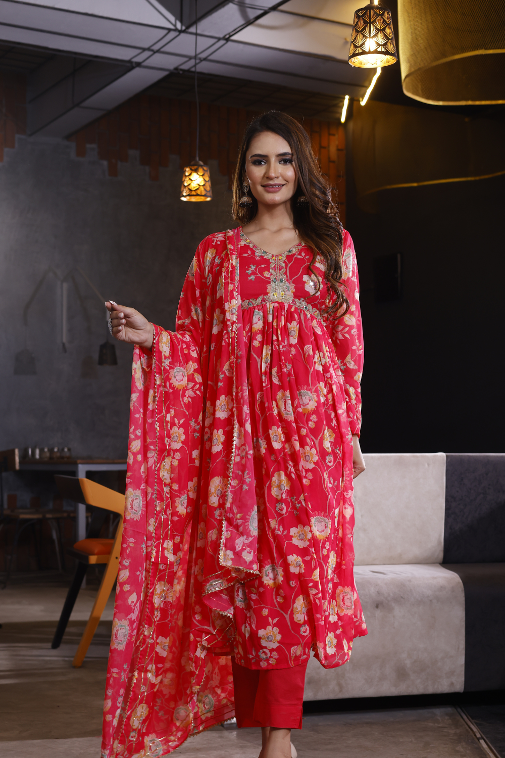 Red suit set featuring floral design in elegant chinon fabric.