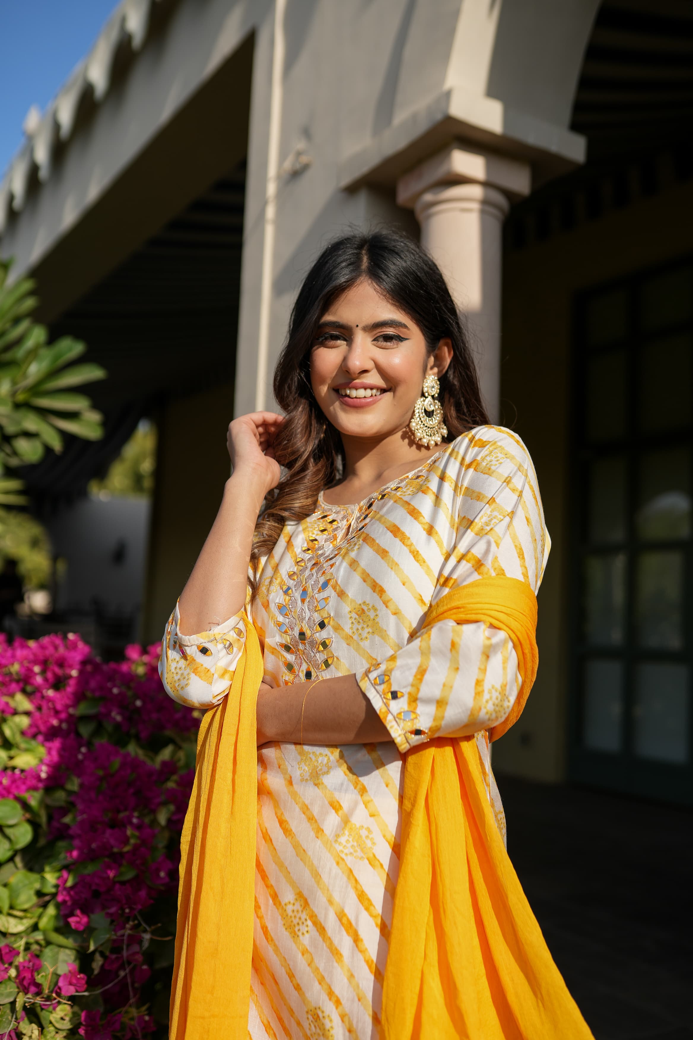 Yellow leheriya straight kurta set with mirror work