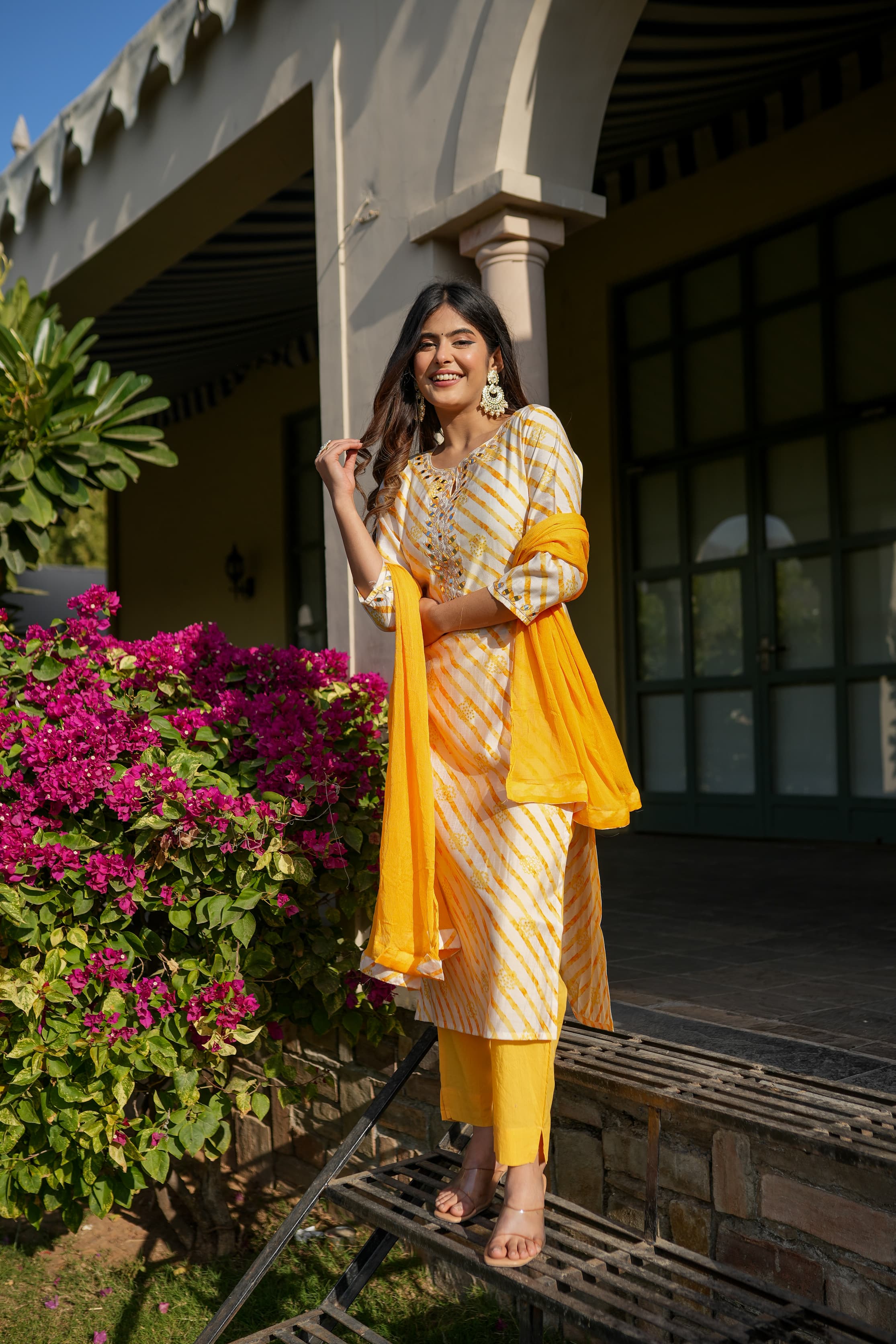 Yellow leheriya straight kurta set with mirror work