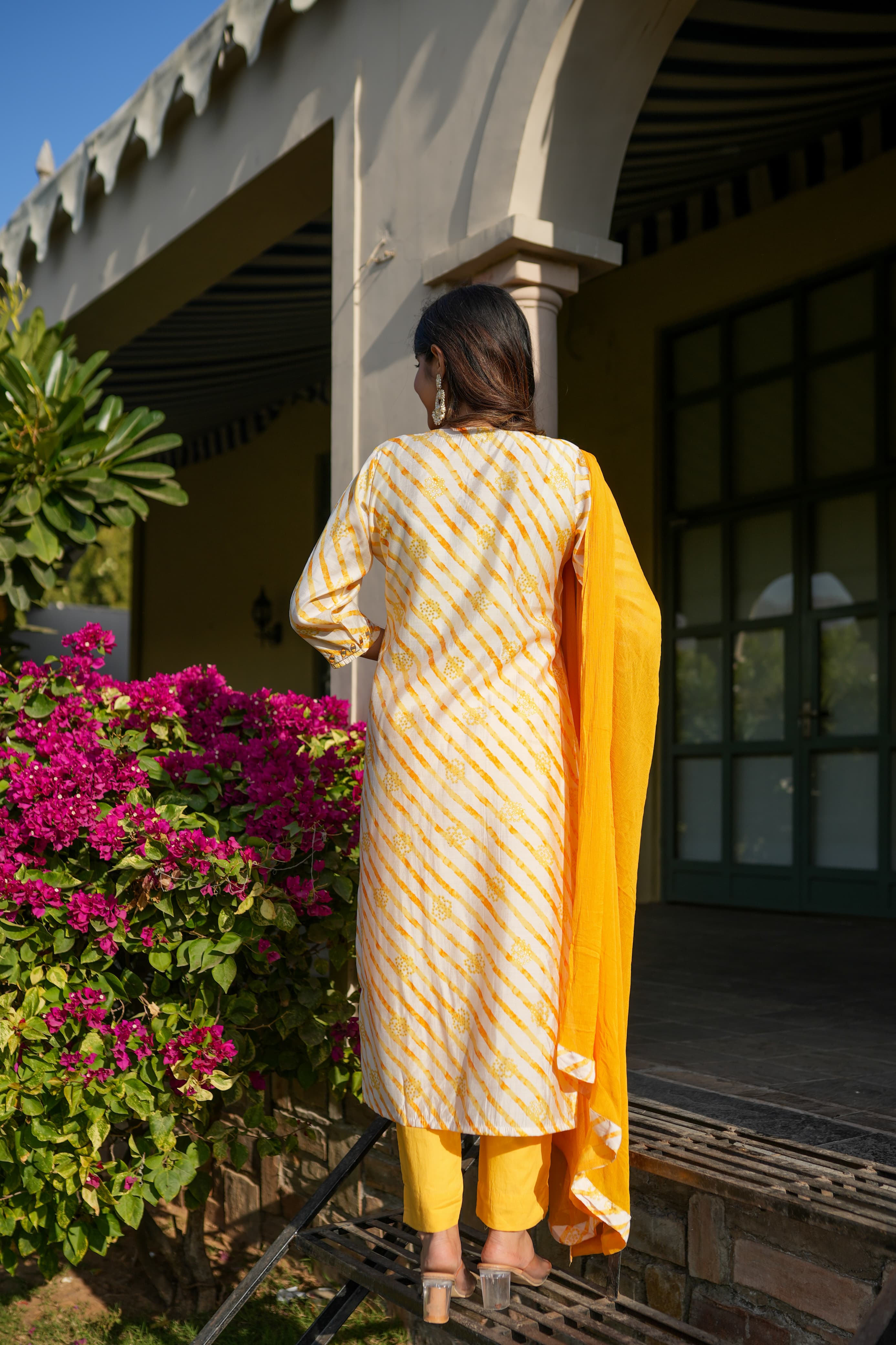 Yellow leheriya straight kurta set with mirror work