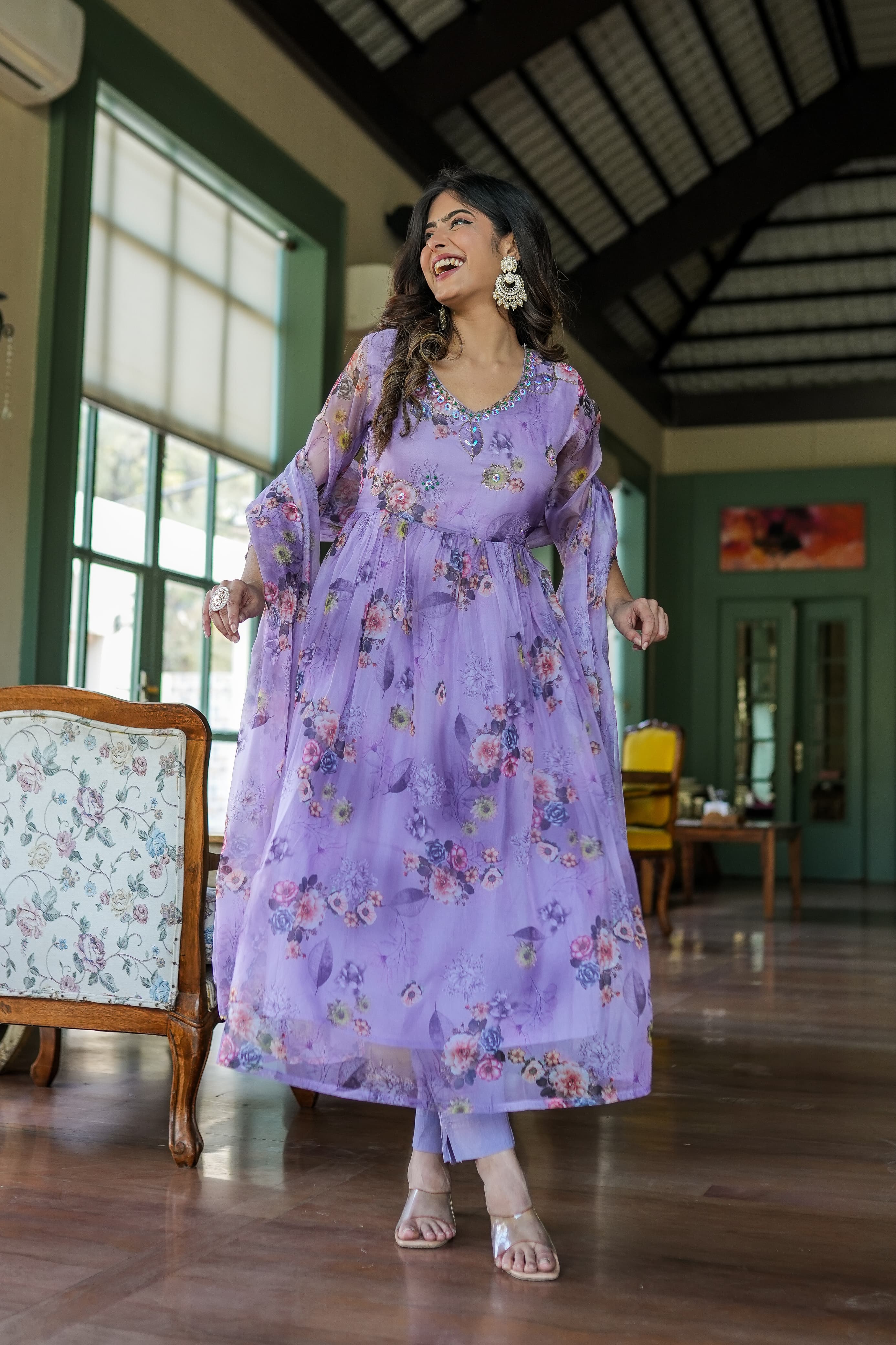Organza Anarkali suit set adorned with elegant purple floral motifs.