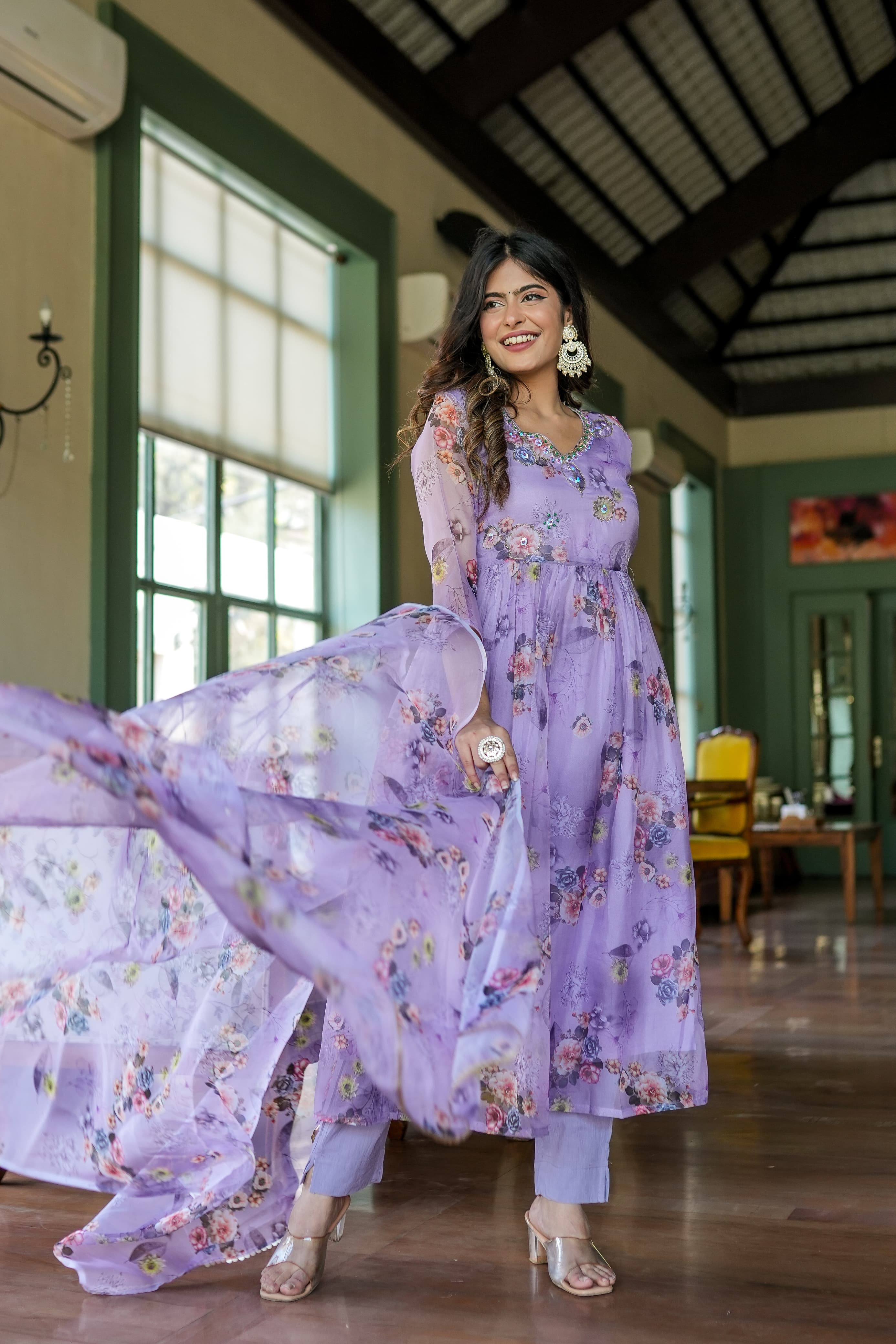 Organza Anarkali suit set adorned with elegant purple floral motifs.